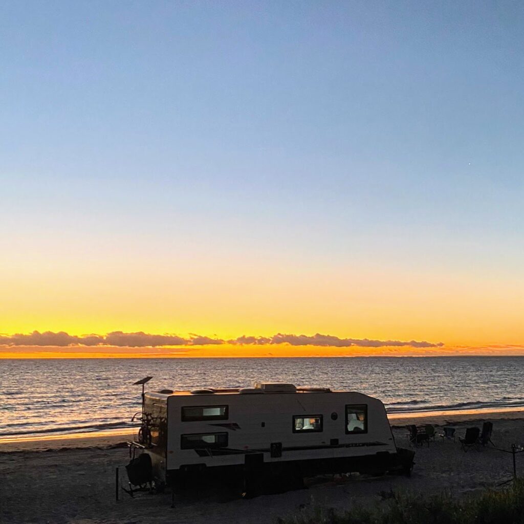 Franky on a beach watching the sunset